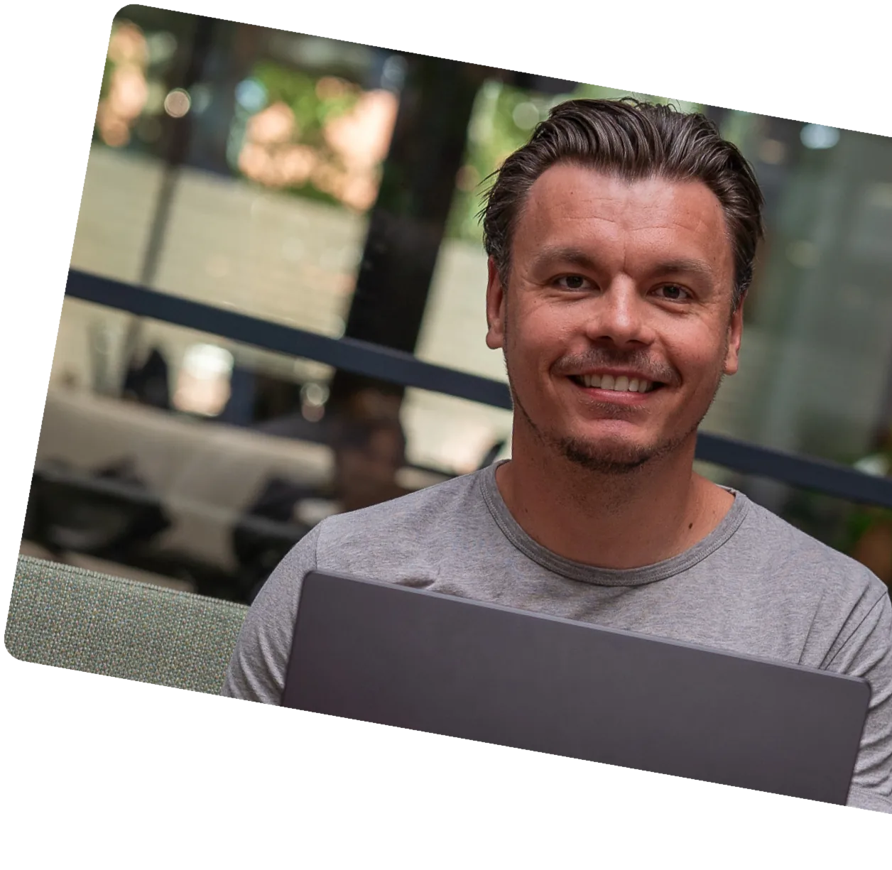 Milo Piróg, co-founder of Microdose Studio, working on a laptop
